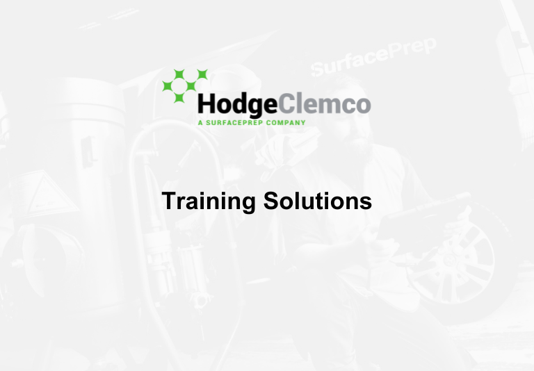 Faint white image of Hodge Clemco worker, with Hodge Clemco's logo, and plain black text which reads 'Training Solutions'